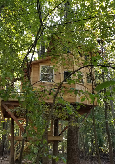 custom backyard tree house by The Treehouse Guys
