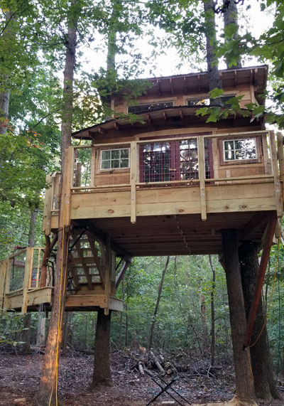 custom backyard tree house by The Treehouse Guys
